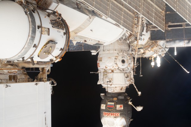 This view of the International Space Station looks toward the aft end of the Russian segment. The Progress 74 resupply ship, which arrived at the station on Dec. 9, is seen docked to the Pirs docking compartment.