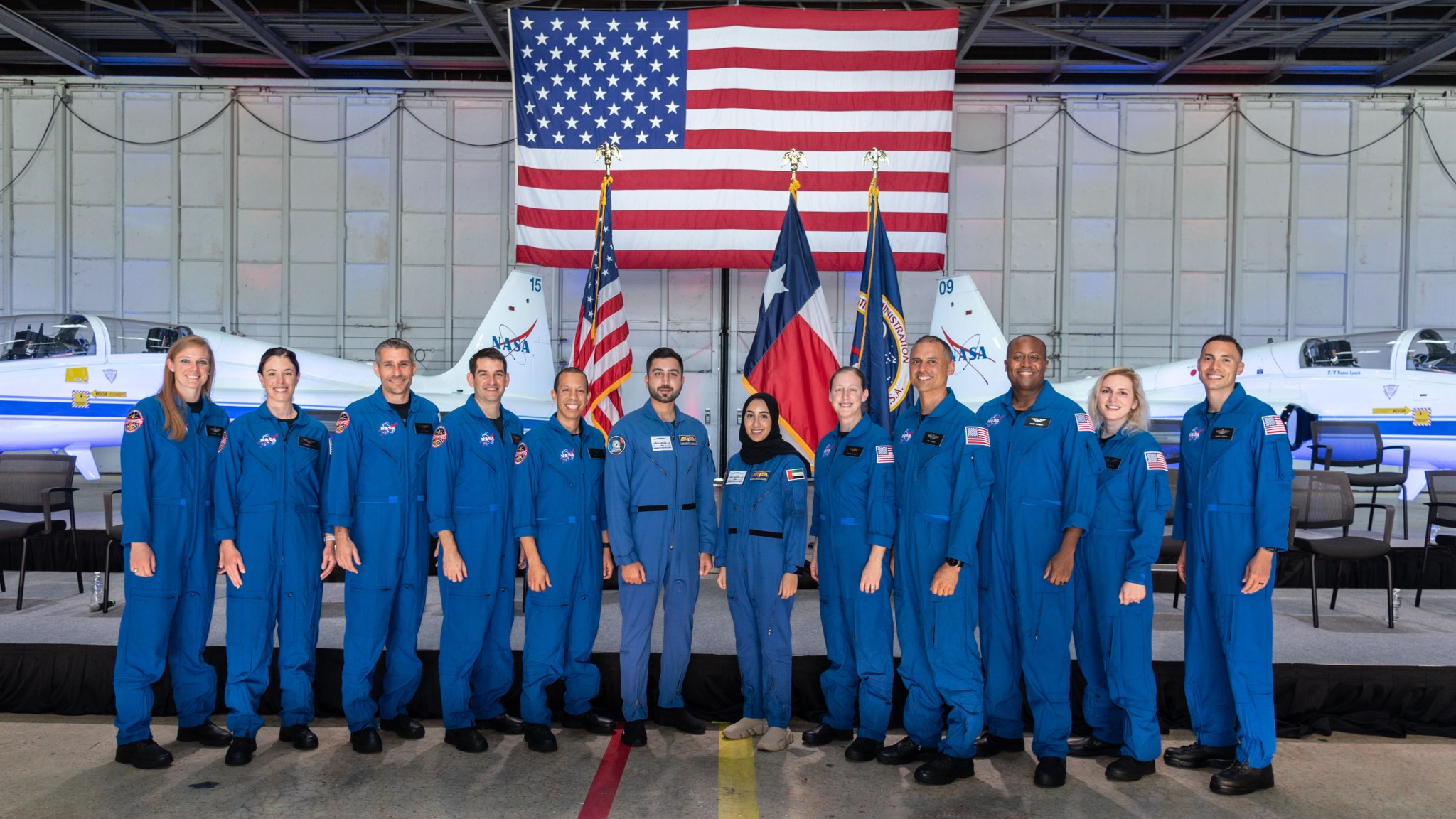 NASA announced its 2021 astronaut candidate class on Dec. 6, 2021. The 10 candidates, pictured here in an event at Ellington Field near NASA’s Johnson Space Center in Houston are Nichole Ayers, Christopher Williams, Luke Delaney, Jessica Wittner, Anil Menon, Marcos Berríos, Jack Hathaway, Christina Birch, Deniz Burnham, and Andre Douglas. UAE Astronaut Candidates Nora AlMatrooshi and Mohammad AlMulla stand alongside them. Credit: NASA/Robert Markowitz