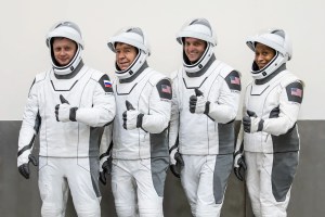  (Left to right) Roscosmos cosmonaut Alexander Grebenkin and NASA astronauts Michael Barratt, Matthew Dominick, and Jeanette Epps pose for a photo during their Crew Equipment Interface Test at NASA’s Kennedy Space Center in Florida. The goal of the training is to rehearse launch day activities and get a close look at the spacecraft. Credit: SpaceX