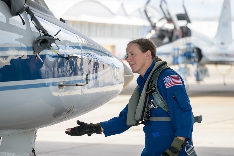 NASA Astronaut Jessica Wittner closely inspects the front of her T-38 aircraft