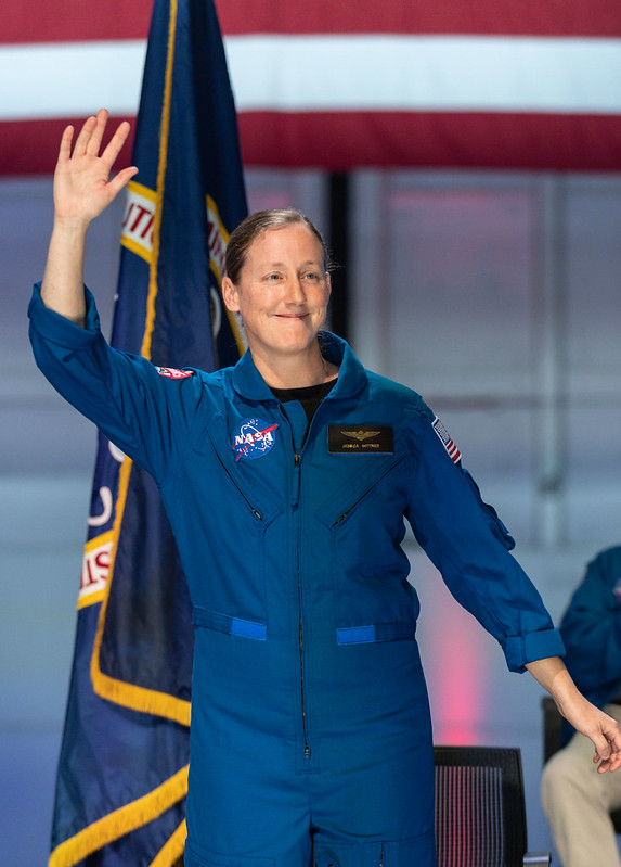 NASA Astronaut Jessica Wittner is seen waving to the crowd following her introduction as one of the 10 new NASA astronaut candidates during an announcement event on Dec. 6, 2021, at Ellington Field near NASA’s Johnson Space Center.