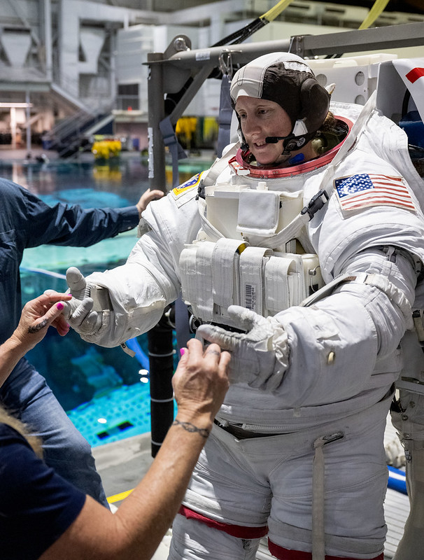 NASA Astronaut Jessica Wittner working with instructor ahead of performing a training session at the Neutral Buoyancy Lab (NBL) near NASA’s Johnson Space Center.