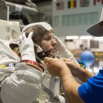 NASA astronaut Zena Cardman, assisted by a technician, trains for a spacewalk at the Neutral Buoyancy Laboratory at NASA's Johnson Space Center in Houston, Texas, for the SpaceX Crew-9 mission to the International Space Station.