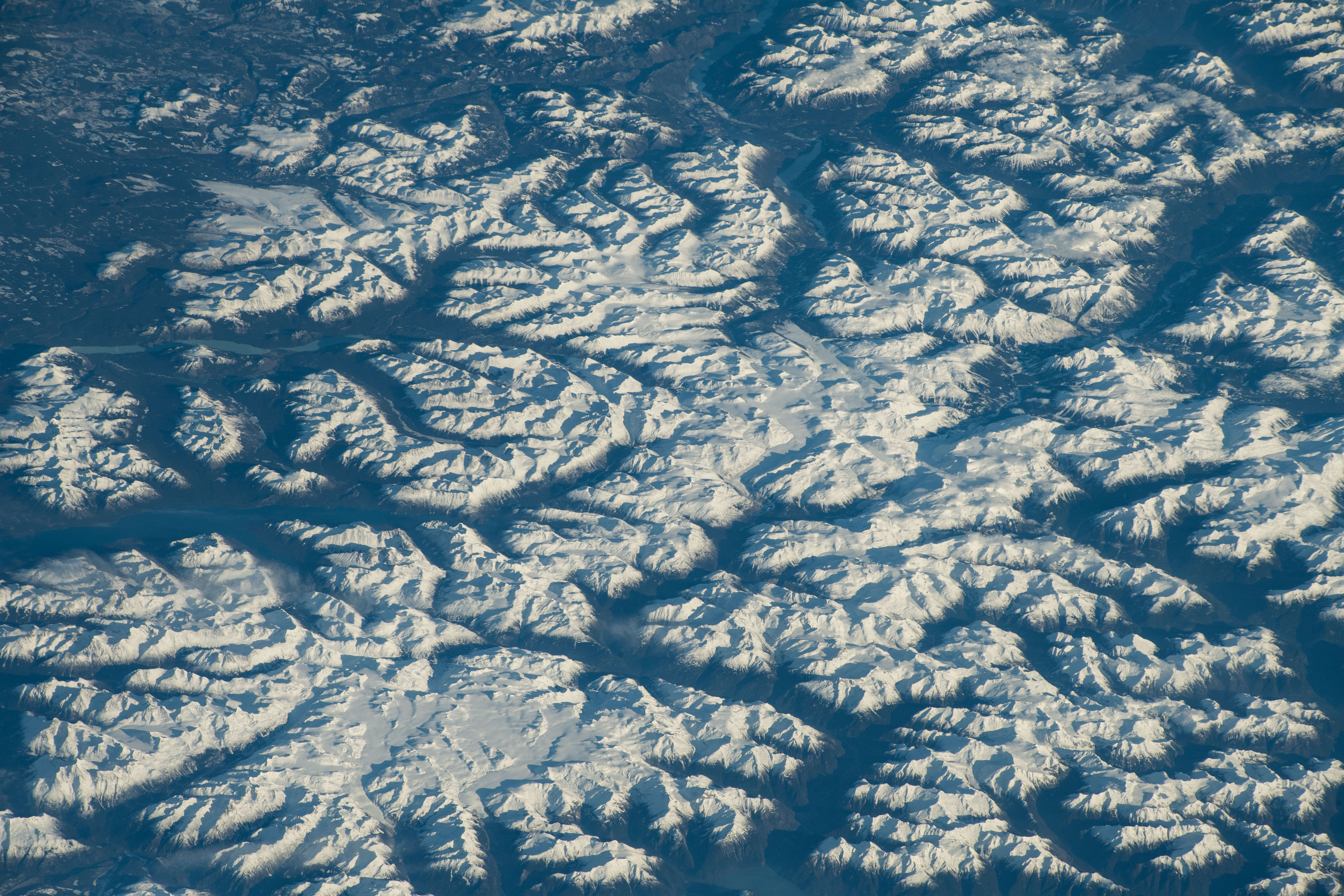 iss070e089837 (Feb. 6, 2023) -- Snow covers the Coast Mountains, highlighting the various peaks of the rugged terrain as the International Space Station orbited 263 miles above the South coast of British Columbia.