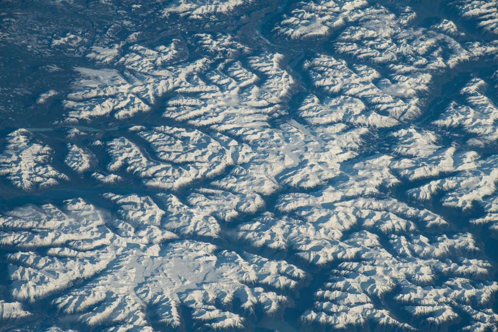 iss070e089837 (Feb. 6, 2023) -- Snow covers the Coast Mountains, highlighting the various peaks of the rugged terrain as the International Space Station orbited 263 miles above the South coast of British Columbia.