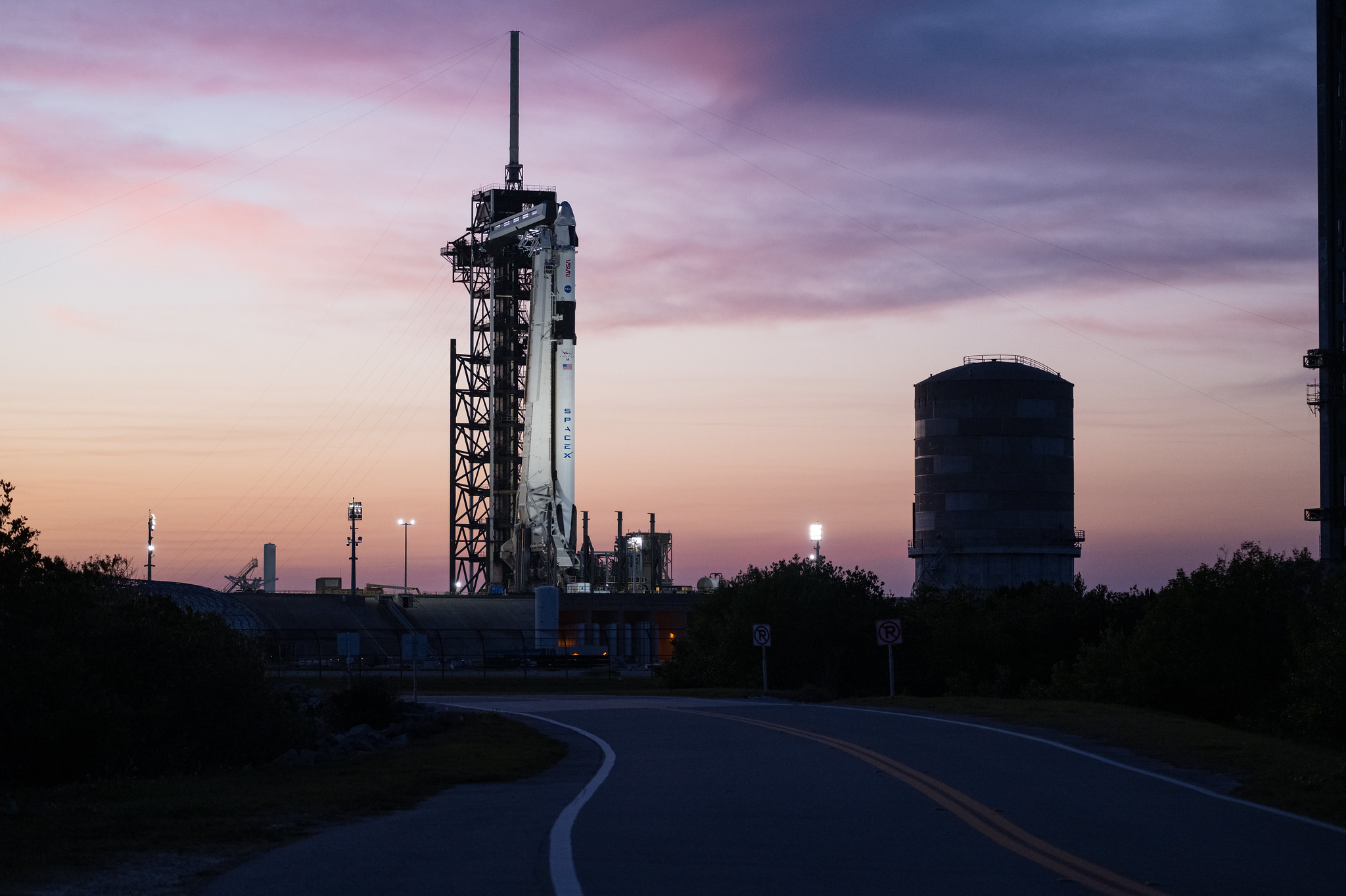 A SpaceX Falcon 9 rocket with the company's Dragon spacecraft on top is seen during sunset on the launch pad at Launch Complex 39A as preparations continue for the Crew-8 mission, Tuesday, Feb. 27, 2024, at NASA’s Kennedy Space Center in Florida.