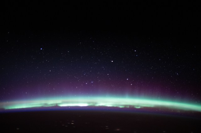iss062e102315 (March 17, 2020) --- A radiant aurora crowns the Earth's horizon beneath a starry sky as the International Space Station orbited 262 miles above the far eastern coast of Russia just off the Sea of Okhotsk.
