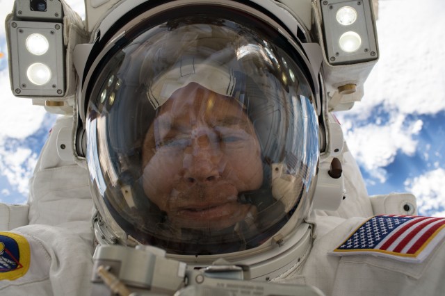 Astronaut Drew Feustel takes an out-of-this-world selfie, or "space-selfie," during a spacewalk on May 16 to swap thermal control gear.