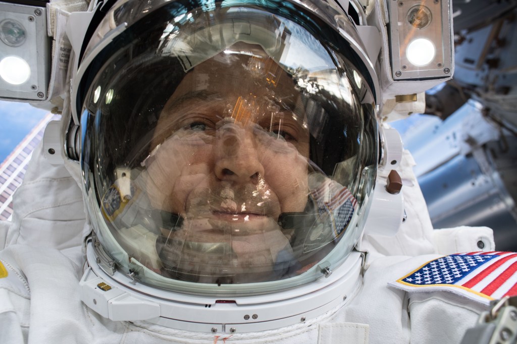 Astronaut Ricky Arnold takes an out-of-this-world selfie, or "space-selfie," during a spacewalk on May 16 to swap thermal control gear.
