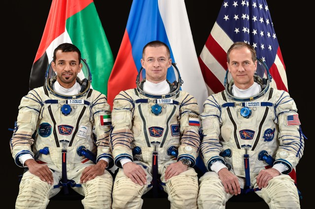 jsc2019e043007 (June 7, 2019) --- (From left) Backup Roscosmos spaceflight participant Sultan al-Neyadi of the United Arab Emirates and backup Expedition 61-62 crewmembers cosmonaut Sergey Ryzhikov of Roscosmos and NASA astronaut Thomas Marshburn pose for a crew portrait at the Gagarin Cosmonaut Training Center in Star City, Russia.