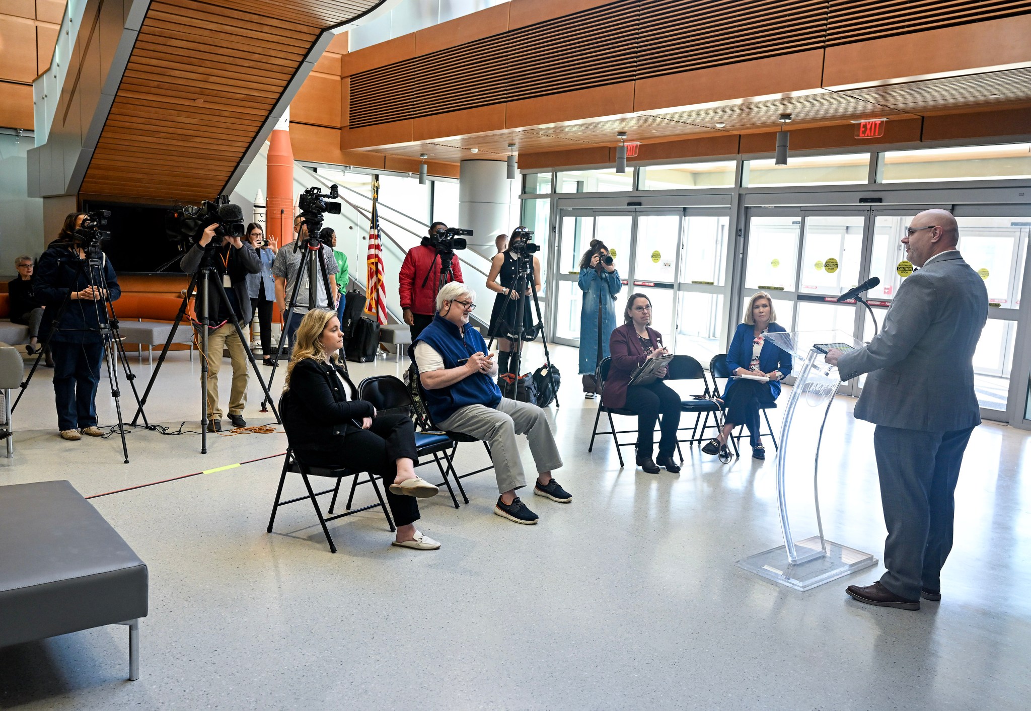 Marshall Center Director Joseph Pelfrey, far right, talks to reporters during his first media event since accepting the director position. The event was held Feb. 15 in the lobby of Building 4221.