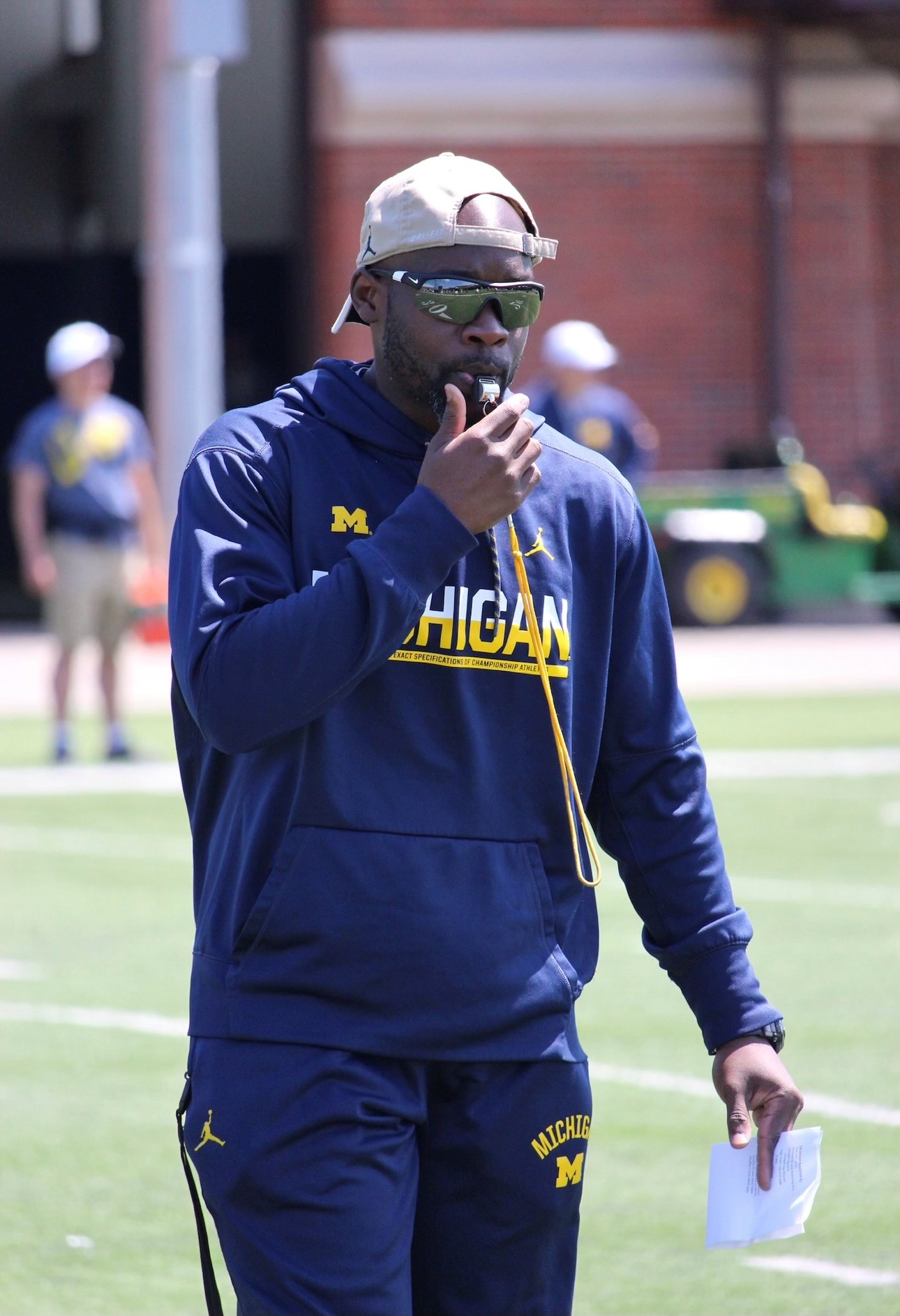 Corey Twine blowing a whistle. He is an Astronaut Fitness Trainer