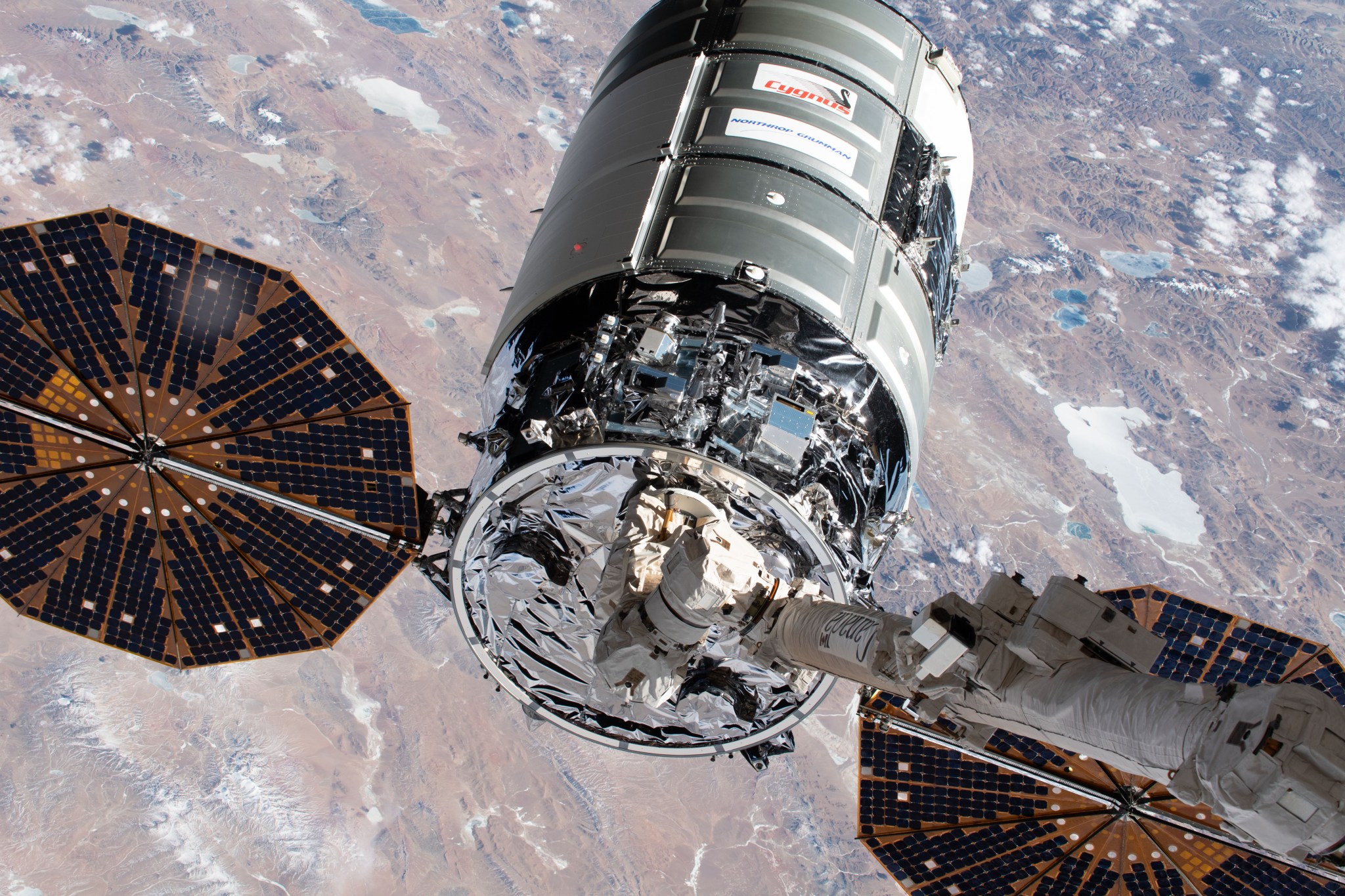 iss062e024005 (Feb. 18, 2020) --- Northrop Grumman's Cygnus cargo craft is pictured in the grips of the Canadarm2 robotic arm shortly after being captured completing a two-and-half-day trip that began with a launch from NASA's Wallops Flight Facility in Virginia.
