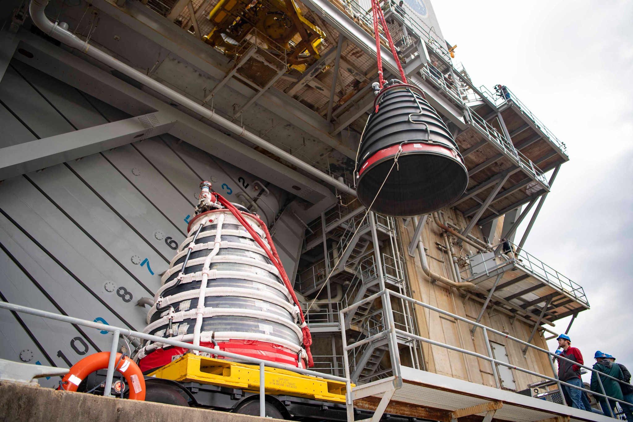 A view of a RS-25 test engine suspended in air on the Fred Haise Test Stand at NASA Stennis