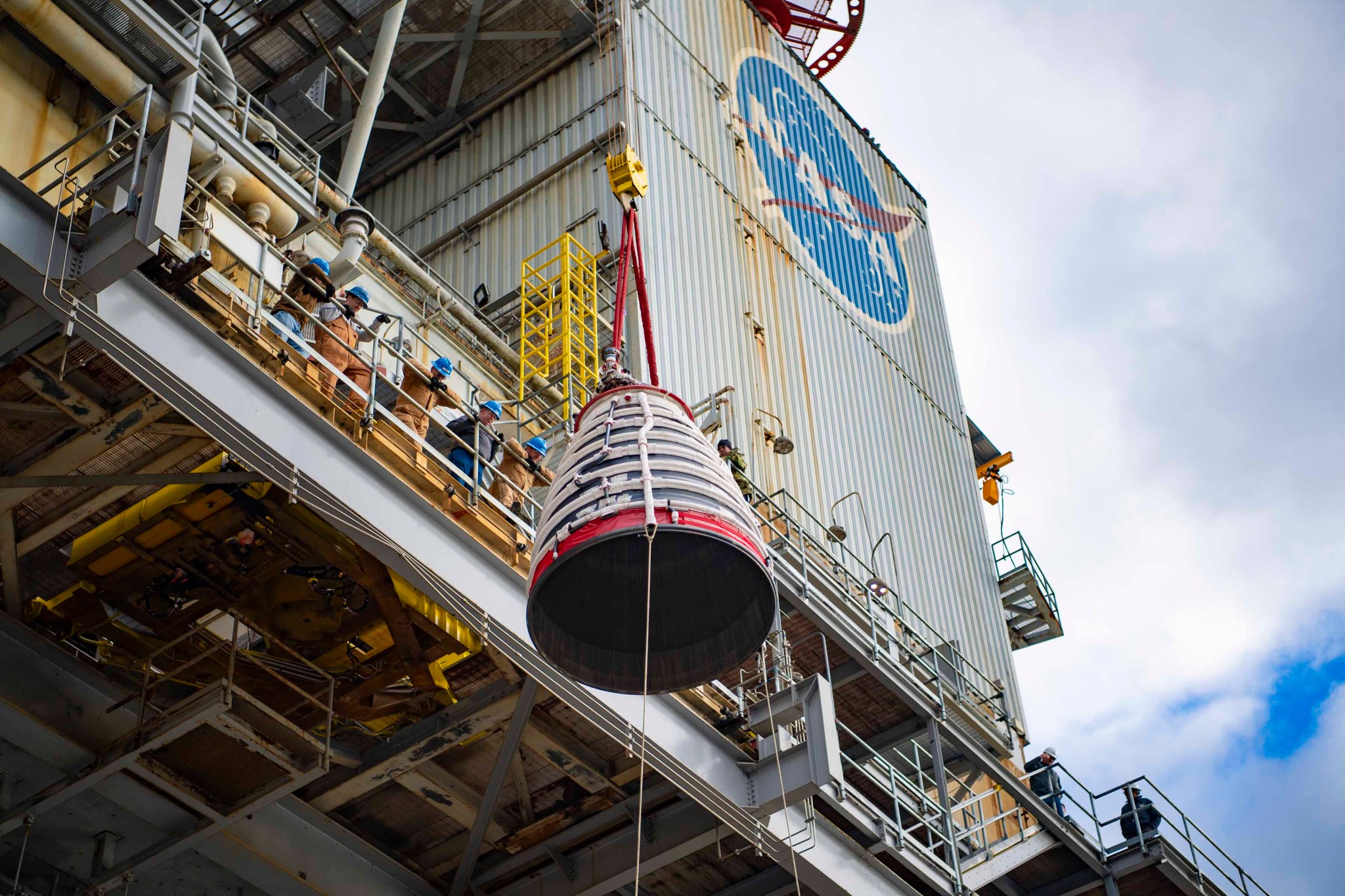 A view of a RS-25 test engine suspended in air on the Fred Haise Test Stand at NASA Stennis