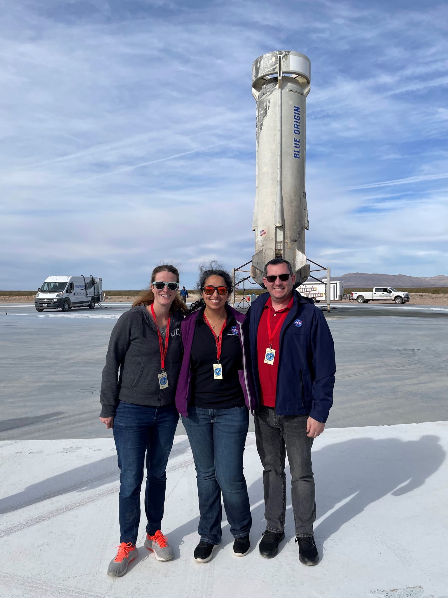 University of Florida and NASA physicists who worked on the ERIE payload pose with Blue Origin booster after launch Tuesday, Dec. 19, 2023.