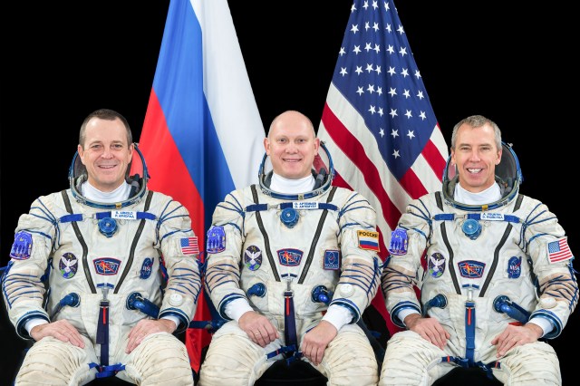 Expedition 55-56 crew members (from left) Ricky Arnold of NASA, Oleg Artemyev of Roscosmos and Drew Feustel of NASA pose for a crew portrait in Sokol launch and entry suits at the Gagarin Cosmonaut Training Center in Star City, Russia.