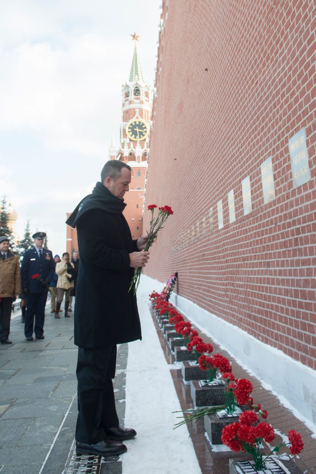 At Red Square in Moscow, Expedition 55 crew member Ricky Arnold of NASA lays flowers at the Kremlin Wall where Russian space icons are interred in traditional pre-launch activities Feb. 22. Arnold, Drew Feustel of NASA and Oleg Artemyev of Roscosmos will launch March 21 on the Soyuz MS-08 spacecraft from the Baikonur Cosmodrome in Kazakhstan for a five-month mission on the International Space Station.
