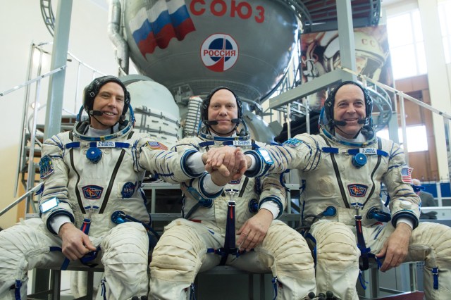 At the Gagarin Cosmonaut Training Center in Star City, Russia, Expedition 55 crew members Drew Feustel of NASA (left), Oleg Artemyev of Roscosmos (center) and Ricky Arnold of NASA (right) pose for pictures Feb. 21 during their final day of crew qualification exams. They will launch March 21 from the Baikonur Cosmodrome in Kazakhstan on the Soyuz MS-08 spacecraft for a five-month mission on the International Space Station.
