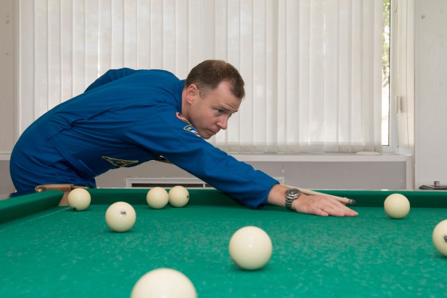Expedition 57 crew member Nick Hague of NASA plays a game of billiards as part of the traditional pre-launch activities, Wednesday, Oct. 3, 2018 at the Cosmonaut Hotel in Baikonur, Kazakhstan. Hague and Alexey Ovchinin of Roscosmos are scheduled to launch on Oct. 11 onboard the Soyuz MS-10 spacecraft from the Baikonur Cosmodrome in Kazakhstan for a six-month mission on the International Space Station.