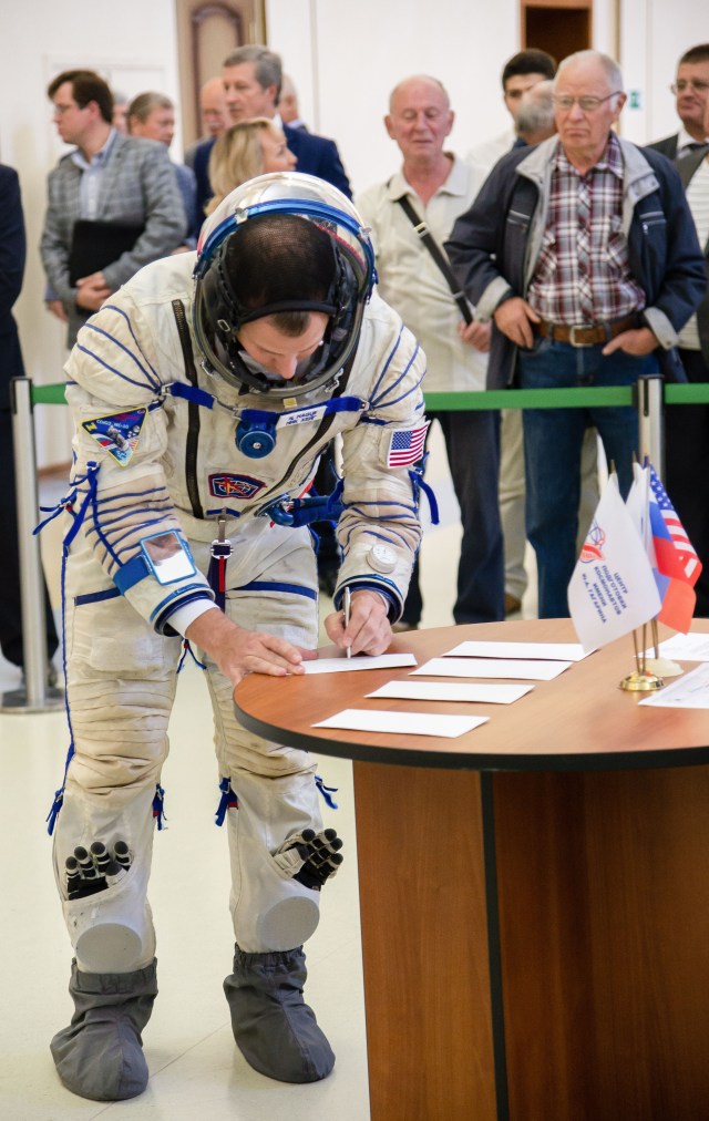 At the Gagarin Cosmonaut Training Center in Star City, Russia, Expedition 57 crew member Nick Hague of NASA signs in Sept. 14 for the second day of Soyuz qualification exams. Hague and Alexey Ovchinin of Roscosmos will launch Oct. 11 on the Soyuz MS-10 spacecraft from the Baikonur Cosmodrome in Kazakhstan for a six-month mission on the International Space Station.
