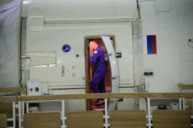 At the Gagarin Cosmonaut Training Center in Star City, Russia, Expedition 57 crewmember Nick Hague of NASA is seen through the hatchway of a Russian module trainer during the first day of qualification exams Sept. 13. Hague and Alexey Ovchinin of Roscosmos are scheduled to launch Oct. 11 from the Baikonur Cosmodrome in Kazakhstan on the Soyuz MS-10 spacecraft for a six month mission on the International Space Station.