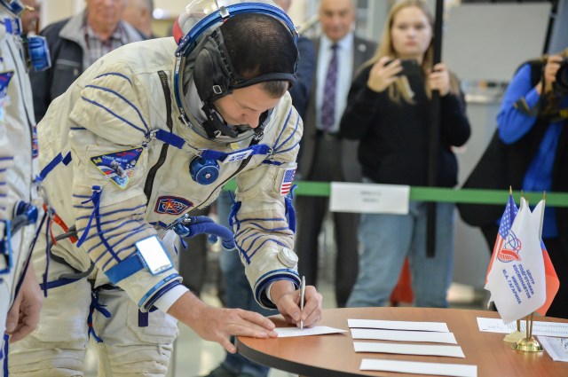 At the Gagarin Cosmonaut Training Center in Star City, Russia, Expedition 57 crew member Nick Hague of NASA signs in Sept. 14 for the second day of Soyuz qualification exams. Hague and Alexey Ovchinin of Roscosmos will launch Oct. 11 on the Soyuz MS-10 spacecraft from the Baikonur Cosmodrome in Kazakhstan for a six-month mission on the International Space Station.