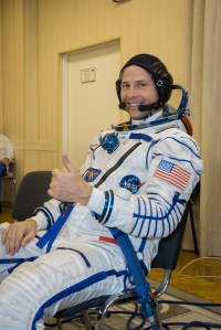 At the Baikonur Cosmodrome in Kazakhstan, Expedition 57 crew member Nick Hague of NASA flashes a thumbs up sign in his Russian Sokol launch and entry suit Sept. 26 during pre-launch training activities. Hague and Alexey Ovchinin of Roscosmos will launch Oct. 11 in the Soyuz MS-10 spacecraft from the Baikonur Cosmodrome for a six-month mission on the International Space Station.