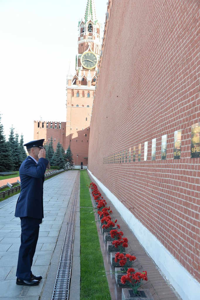 At Red Square in Moscow, Expedition 57 crew member Nick Hague of NASA salutes after laying flowers at the Kremlin Wall where Russian space icons are interred as part of traditional ceremonies Sept. 17. Hague and Alexey Ovchinin of Roscosmos will launch Oct. 11 from the Baikonur Cosmodrome in Kazakhstan on the Soyuz MS-10 spacecraft for a six-month mission on the International Space Station.