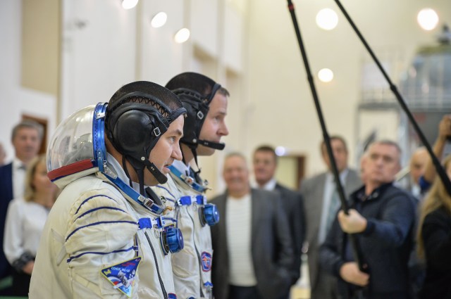 At the Gagarin Cosmonaut Training Center in Star City, Russia, Expedition 57 crew members Alexey Ovchinin of Roscosmos (foreground) and Nick Hague of NASA (right) report to officials Sept. 14 for the second day of their Soyuz qualification exams. They will launch Oct. 11 on the Soyuz MS-10 spacecraft from the Baikonur Cosmodrome in Kazakhstan for a six-month mission on the International Space Station.