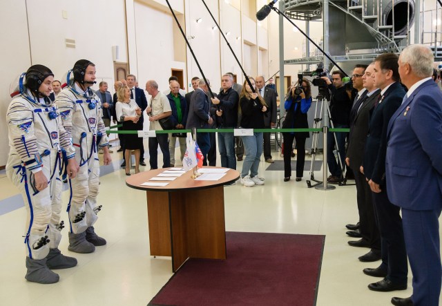 At the Gagarin Cosmonaut Training Center in Star City, Russia, Expedition 57 crew members Alexey Ovchinin of Roscosmos (left) and Nick Hague of NASA (right) report to officials Sept. 14 for the second day of their Soyuz qualification exams. They will launch Oct. 11 on the Soyuz MS-10 spacecraft from the Baikonur Cosmodrome in Kazakhstan for a six-month mission on the International Space Station.