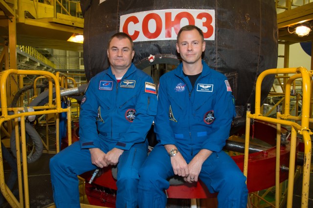 At the Baikonur Cosmodrome in Kazakhstan, Expedition 57 crew members Alexey Ovchinin of Roscosmos (left) and Nick Hague of NASA (right) pose for pictures in front of their Soyuz MS-10 spacecraft Sept. 26 during final pre-launch training. Ovchinin and Hague will launch Oct. 11 in the Soyuz MS-10 from the Baikonur Cosmodrome for a six-month mission on the International Space Station.