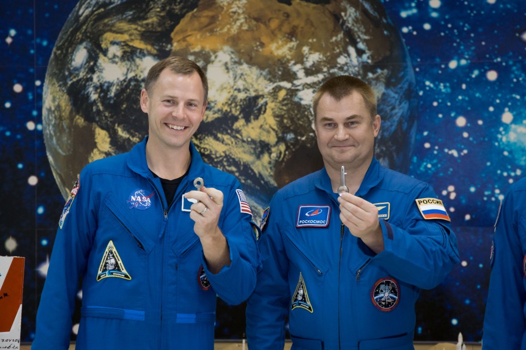 At the Baikonur Cosmodrome Museum in Kazakhstan, Expedition 57 Nick Hague of NASA (left) and Alexey Ovchinin of Roscosmos (right) display “launch keys” they were presented Oct. 6 during a traditional pre-launch tour of the facility. Hague and Ovchinin will launch Oct. 11 from the Baikonur Cosmodrome on the Soyuz MS-10 spacecraft for a six-month mission on the International Space Station.