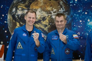At the Baikonur Cosmodrome Museum in Kazakhstan, Expedition 57 Nick Hague of NASA (left) and Alexey Ovchinin of Roscosmos (right) display “launch keys” they were presented Oct. 6 during a traditional pre-launch tour of the facility. Hague and Ovchinin will launch Oct. 11 from the Baikonur Cosmodrome on the Soyuz MS-10 spacecraft for a six-month mission on the International Space Station.