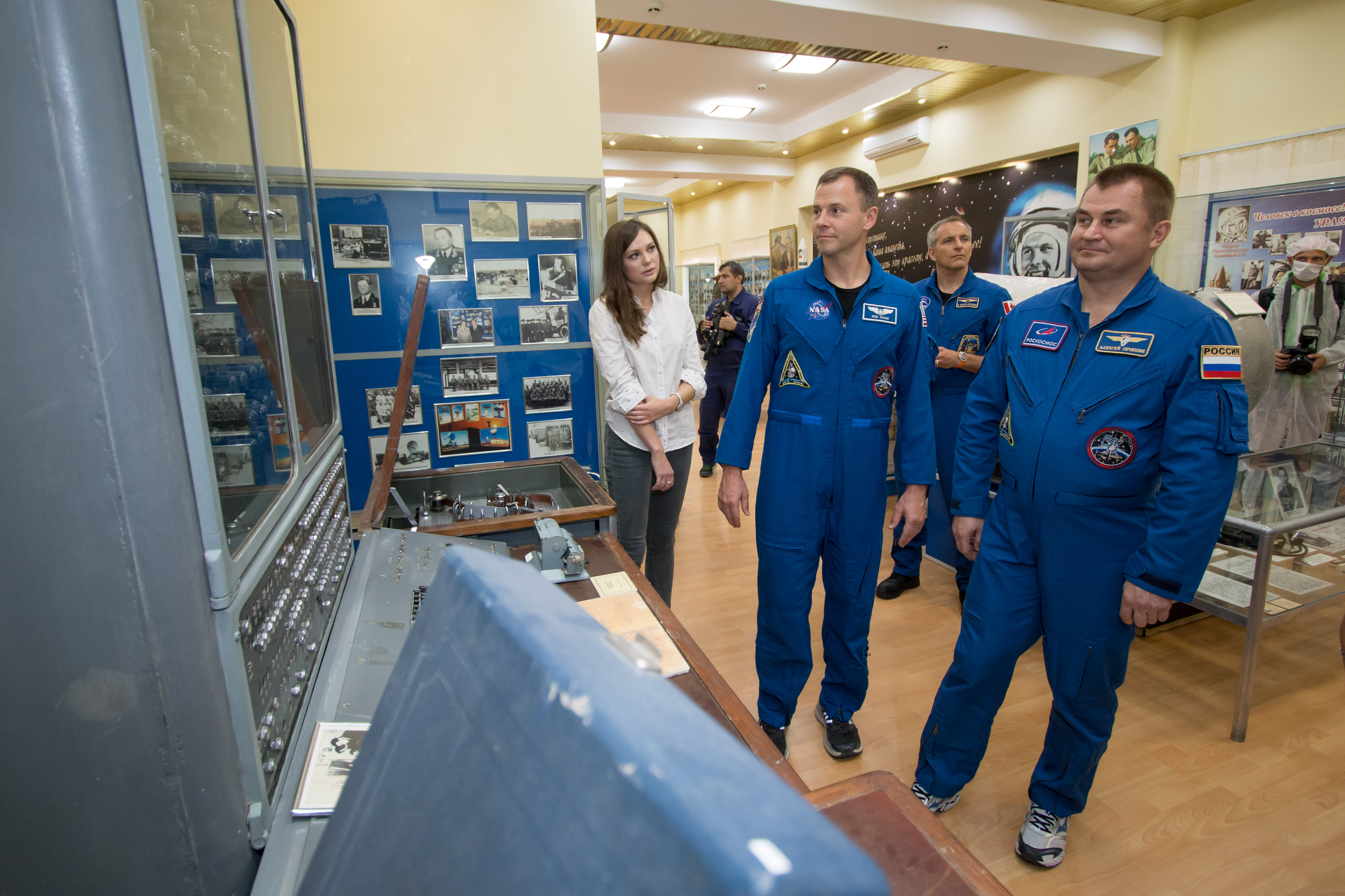 At the Baikonur Cosmodrome Museum in Kazakhstan, Expedition 57 crewmembers Nick Hague of NASA (left) and Alexey Ovchinin of Roscosmos view space artifacts Oct. 6 as part of a traditional pre-launch tour. Behind them is backup crewmember David Saint-Jacques of the Canadian Space Agency. Hague and Ovchinin will launch Oct. 11 from the Baikonur Cosmodrome on the Soyuz MS-10 spacecraft for a six-month mission on the International Space Station.