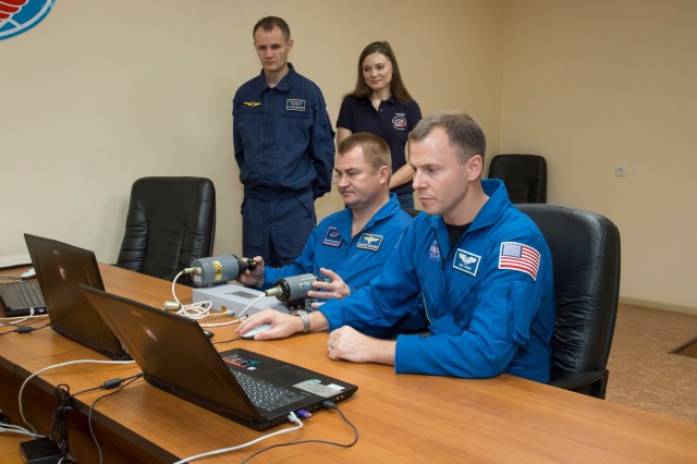 Expedition 57 crew members Alexey Ovchinin of Roscosmos, left, and Nick Hague of NASA, right, conduct rendezvous and docking procedures on a laptop training simulator as part of their pre-launch preparations, Wednesday, Oct. 3, 2018 at the Cosmonaut Hotel in Baikonur, Kazakhstan. Ovchinin and Hague are scheduled to launch on Oct. 11 onboard the Soyuz MS-10 spacecraft from the Baikonur Cosmodrome in Kazakhstan for a six-month mission on the International Space Station.