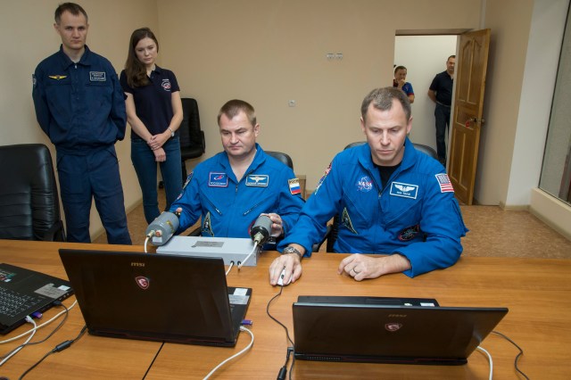 Expedition 57 crew members Alexey Ovchinin of Roscosmos, left, and Nick Hague of NASA, right, conduct rendezvous and docking procedures on a laptop training simulator as part of their pre-launch preparations, Wednesday, Oct. 3, 2018 at the Cosmonaut Hotel in Baikonur, Kazakhstan. Ovchinin and Hague are scheduled to launch on Oct. 11 onboard the Soyuz MS-10 spacecraft from the Baikonur Cosmodrome in Kazakhstan for a six-month mission on the International Space Station.