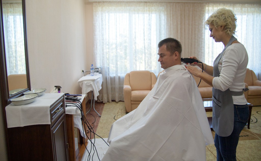Expedition 57 Flight Engineer Alexey Ovchinin of Roscosmos gets his hair cut, Tuesday, Oct. 9, 2018 at the Cosmonaut Hotel in Baikonur, Kazakhstan. Ovchinin and Expedition 57 Flight Engineer Nick Hague of NASA are scheduled to launch onboard a Soyuz rocket October 11 and will spend the next six months living and working aboard the International Space Station.