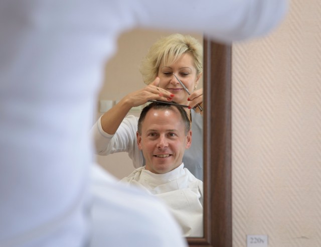 Expedition 57 Flight Engineer Nick Hague of NASA gets his hair cut, Tuesday, Oct. 9, 2018 at the Cosmonaut Hotel in Baikonur, Kazakhstan. Hague and Expedition 57 Flight Engineer Alexey Ovchinin of Roscosmos are scheduled to launch onboard a Soyuz rocket October 11 and will spend the next six months living and working aboard the International Space Station.