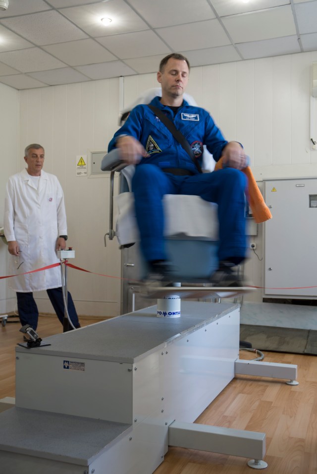 Expedition 57 prime crew member Nick Hague of NASA takes a spin in a rotating chair to test his vestibular system as part of pre-launch activities, Wednesday, Oct. 3, 2018 at the Cosmonaut Hotel in Baikonur, Kazakhstan. Hague and Alexey Ovchinin of Roscosmos are scheduled to launch on Oct. 11 onboard the Soyuz MS-10 spacecraft from the Baikonur Cosmodrome in Kazakhstan for a six-month mission on the International Space Station.