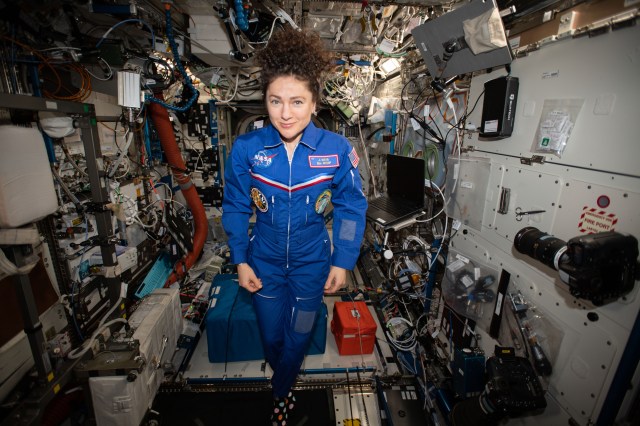 iss062e116087 (March 29, 2020) --- NASA astronaut and Expedition 62 Flight Engineer Jessica Meir poses for a portrait in the weightless environment of the International Space Station.