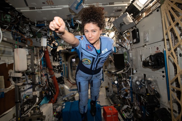 iss062e116009 (March 29, 2020) --- NASA astronaut and Expedition 62 Flight Engineer Jessica Meir strikes a superhero pose in the weightless environment of the International Space Station.