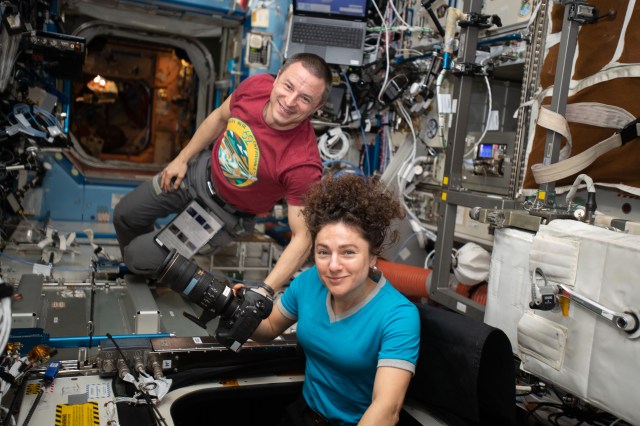 iss062e141186 (March 10, 2020) --- NASA astronauts and Expedition 62 Flight Engineers Andrew Morgan and Jessica Meir participate in Earth photography activities inside the Destiny laboratory module's Window Observation Research Facility.