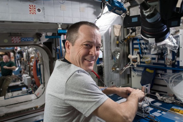 NASA astronaut and Flight Engineer Ricky Arnold works with the student-designed Genes in Space-5 experiment inside the Harmony module. The genetic research is helping scientists understand the relationship between DNA alterations and weakened immune systems possibly caused by living in space.