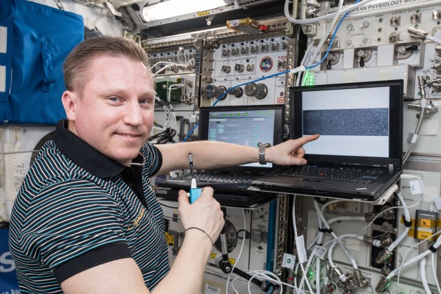 Russian cosmonaut and Expedition 57 Flight Engineer Sergey Prokopyev is pictured inside Europe's Columbus lab module conducting research for the Plasma Krystall-4 experiment that researches how microgravity, electric fields and the Sun impact complex plasmas which are low temperature gaseous mixtures composed of ionized gas, neutral gas, and micron-sized particles..