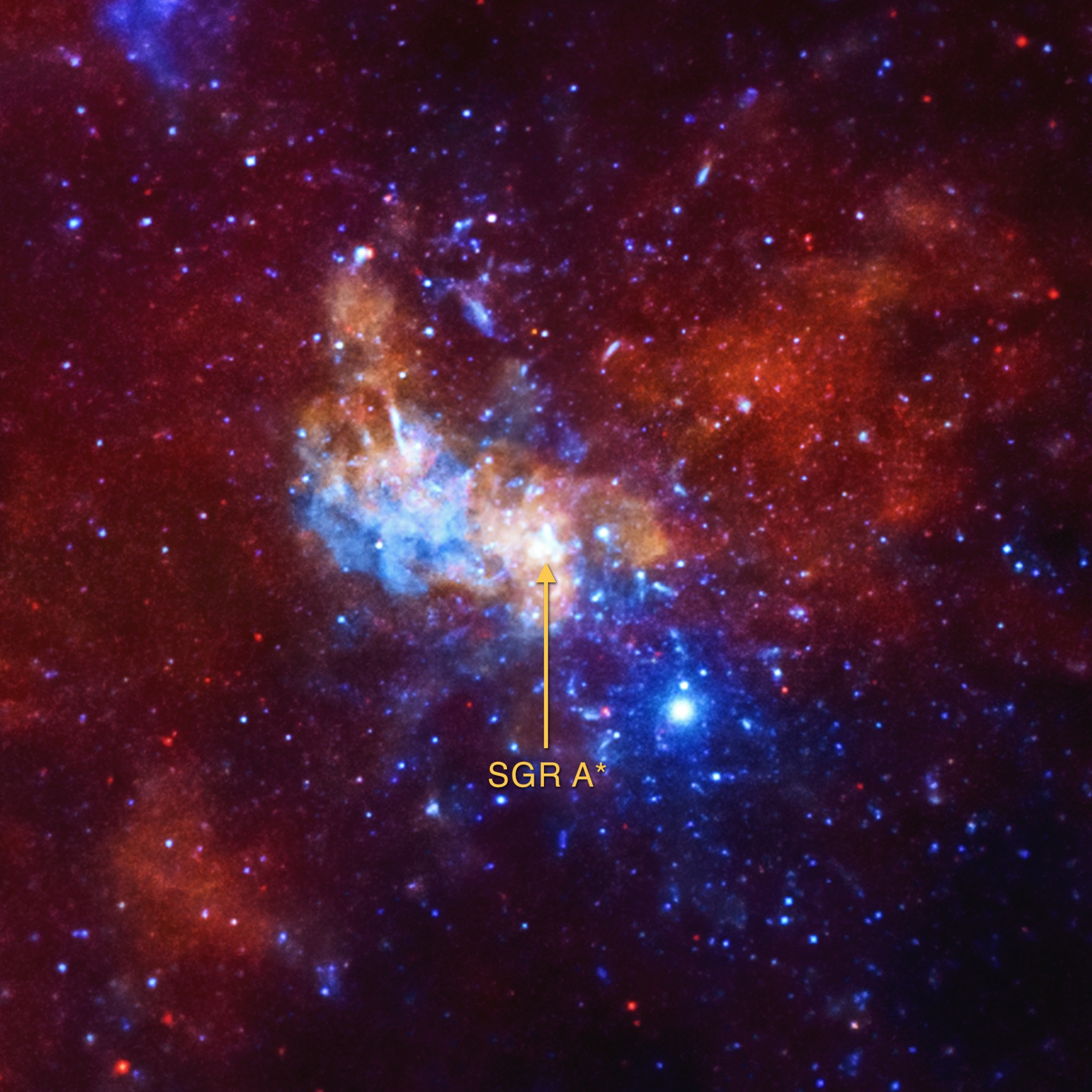 The supermassive black hole at the center of the Milky Way may be producing tiny particles, called neutrinos, that have virtually no mass and carry no electric charge. This Chandra image shows the region around the black hole, known as Sagittarius A*, in low, medium, and high-energy X-rays (red, green, and blue respectively.) Scientists have found a connection to outbursts generated by the black hole and seen by Chandra and other X-ray telescopes with the detection of high-energy neutrinos in an observatory under the South Pole.