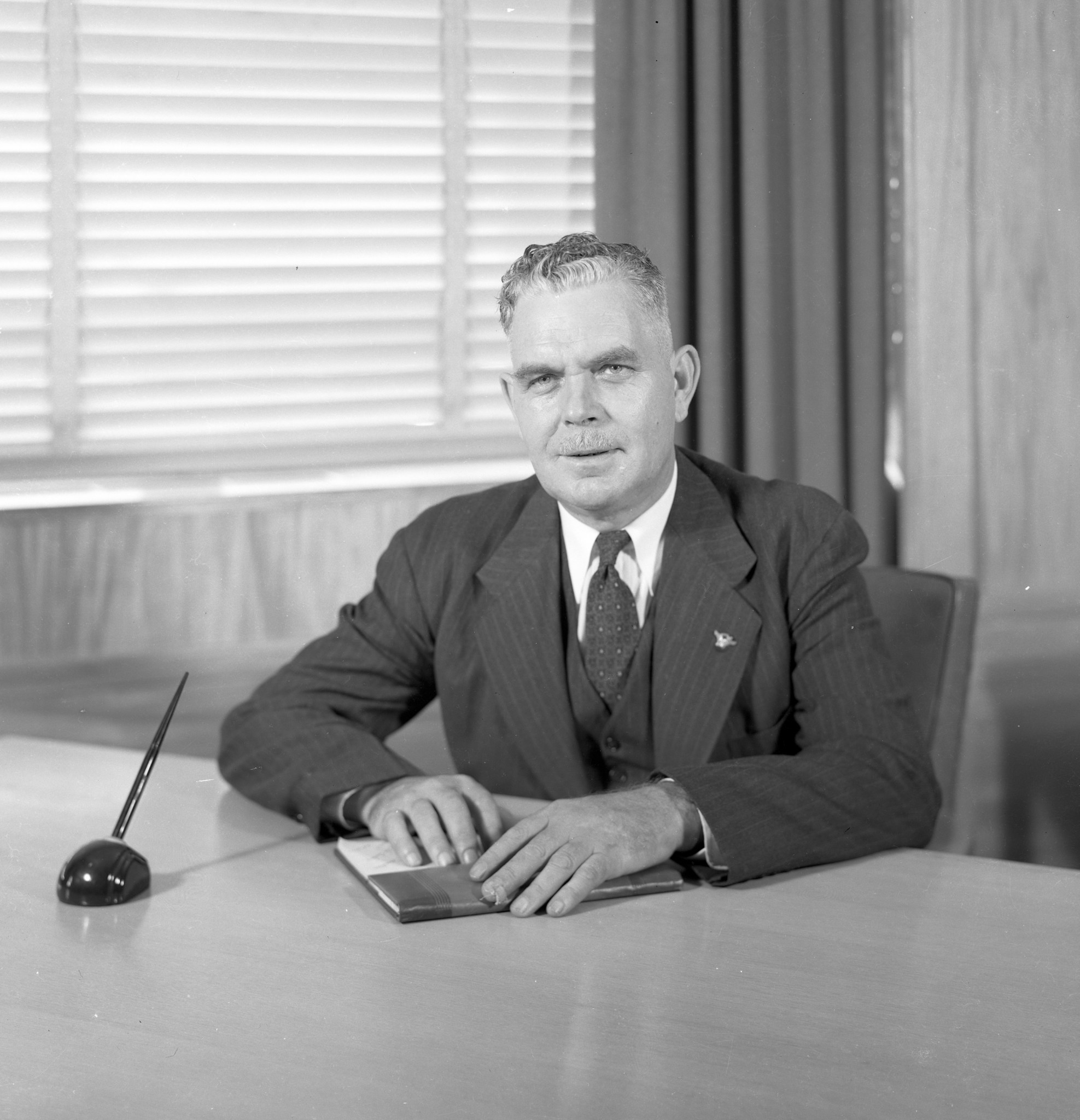 Man sitting at desk.