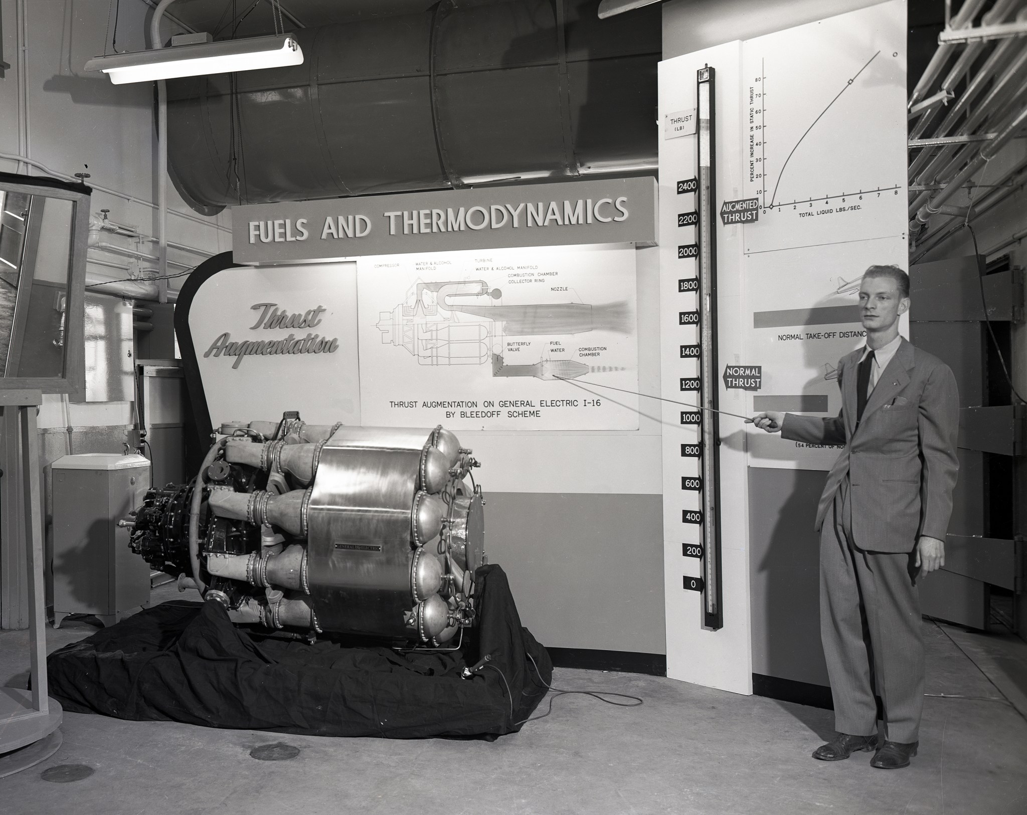 Man standing uin front of display.