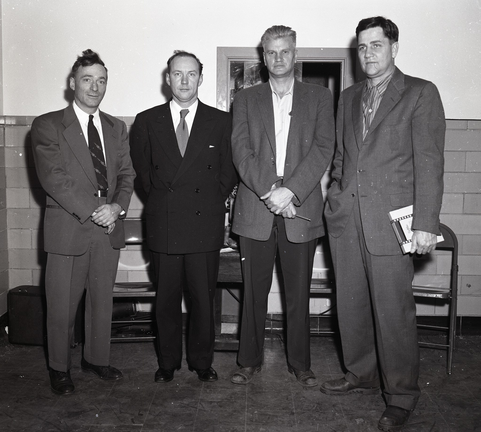 Four men standing.
