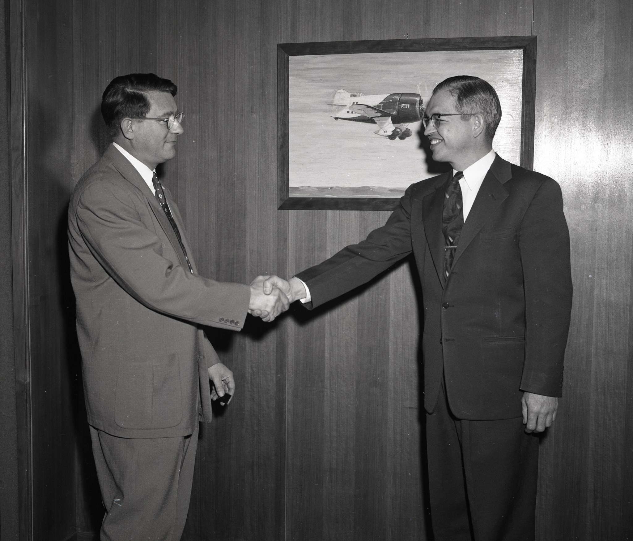 Two men shaking hands.